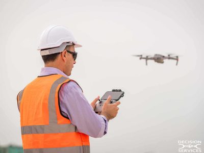 © DecisionDrone - feature image of remote pilot and craft (stock)